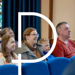 A family enjoying Sunday worship at St Columba's Derryvolgie