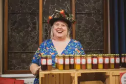 Local artisan proudly displaying homemade preserves and chutneys at Derryvolgie Twilight Market